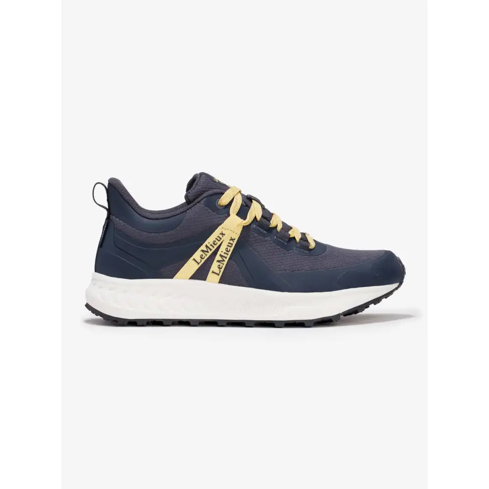 Navy blue lemieux youth trax dusk running shoe with yellow laces and white midsole trax viva waterproof trainer