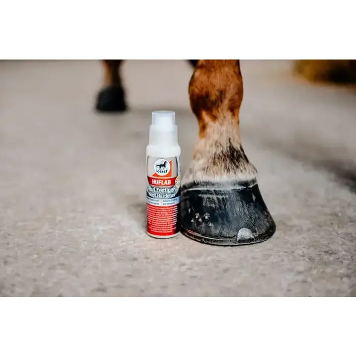 White and red leovet hoof lab spray bottle with white cap for nail holes and lab hoof hardener to toughen horse hooves