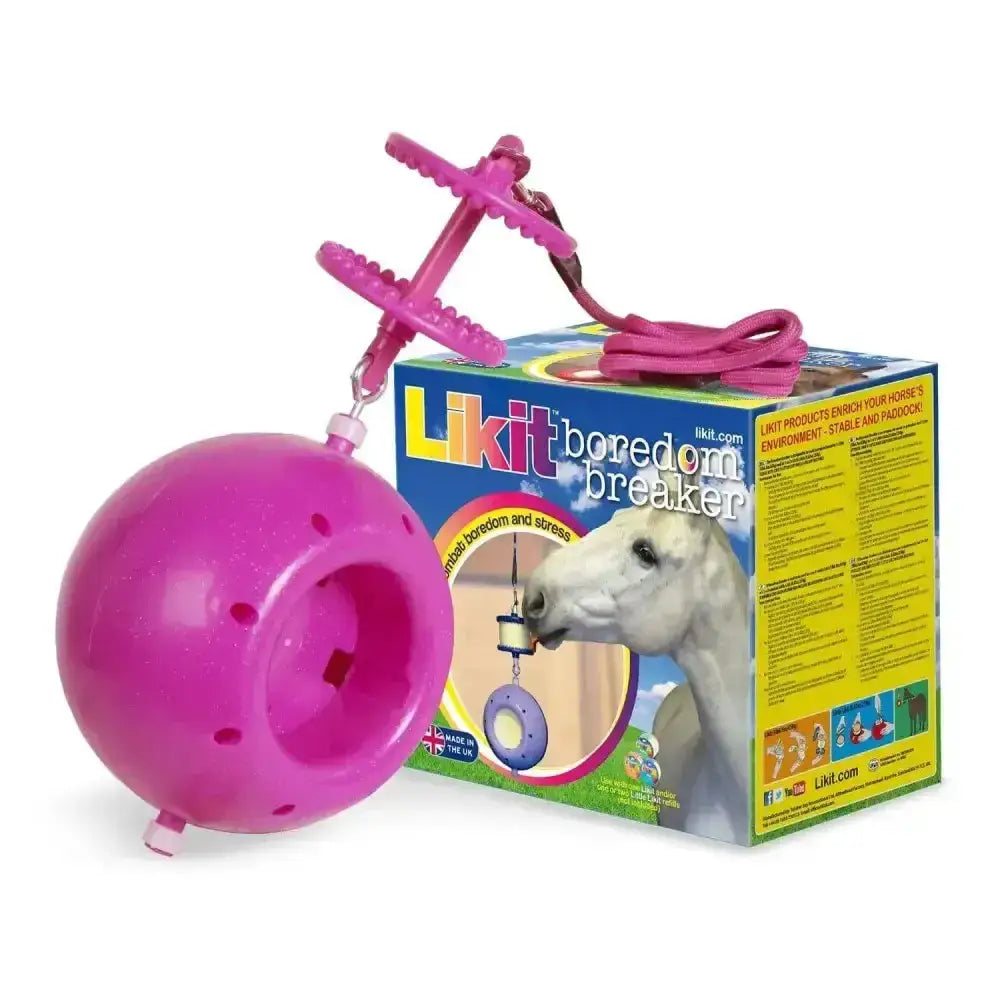 Pink plastic spherical likit boredom breaker with a dangling chew toy attached by a chain for horses