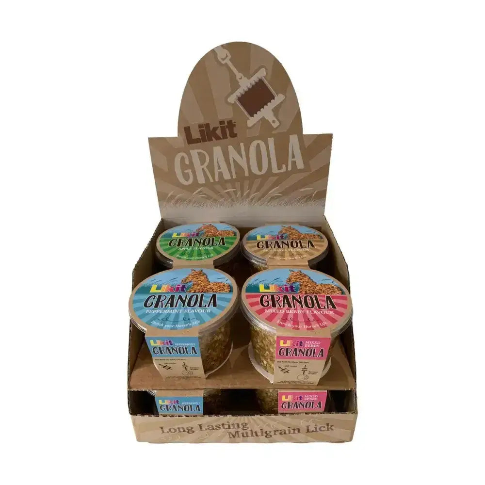 Brown cardboard display box holding four colorful likit granola multigrain assorted cups with rock hard formulation