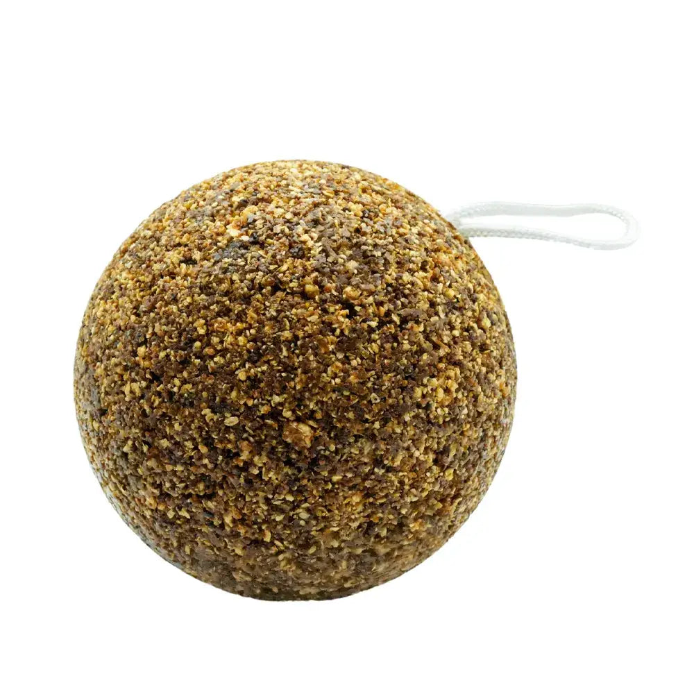 A round textured likit granolo stall-ball bath bomb in speckled brown and beige with a white hanging string loop
