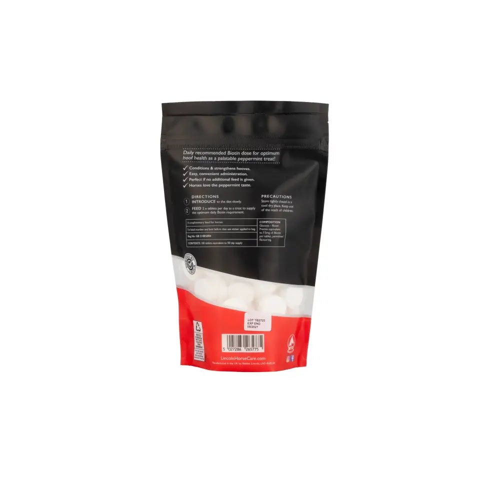 Black and red resealable pouch of lincoln biotin daily hoof care supplement with white peppermint lozenges for tasty hoof care