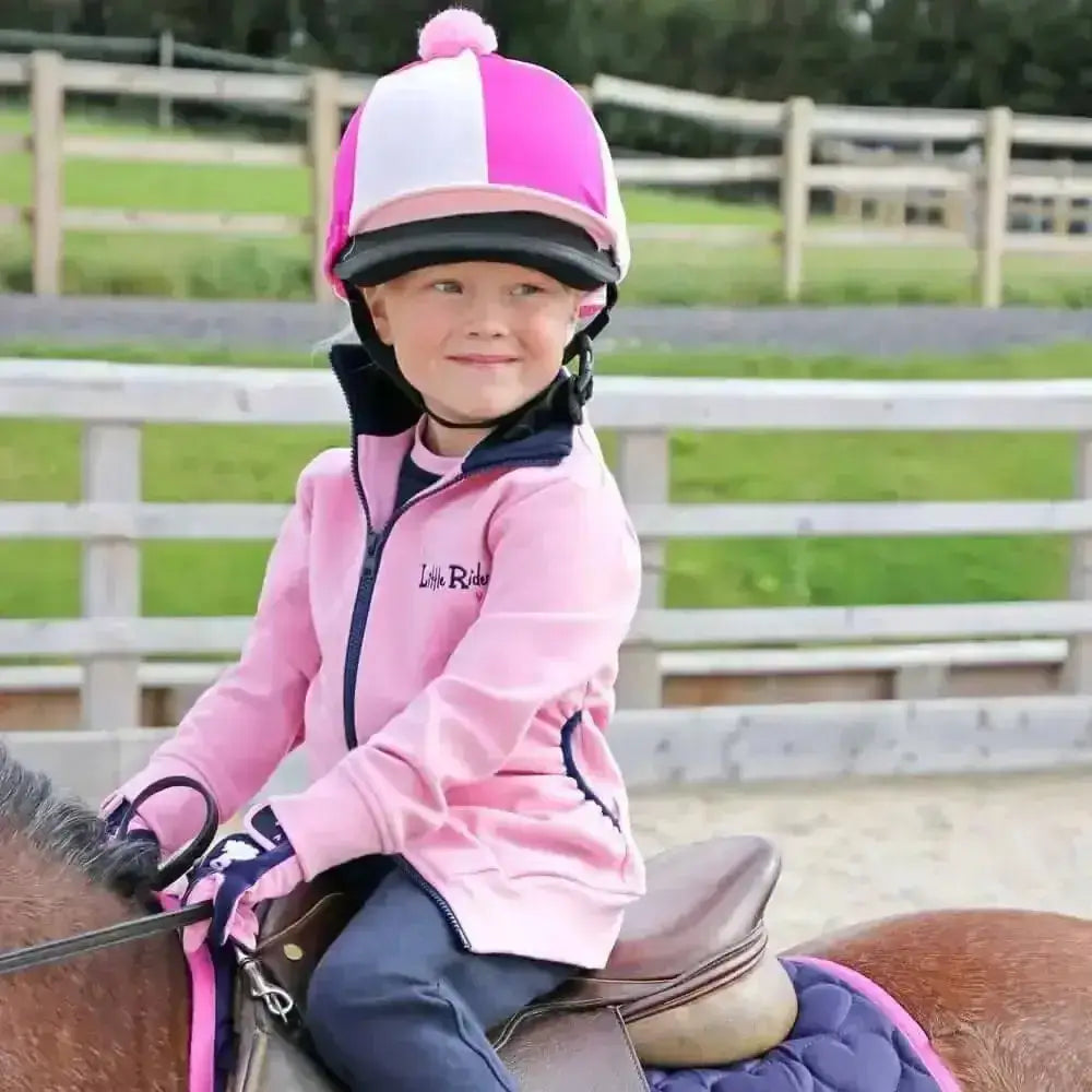 Pink and white striped equestrian helmet with fluffy pink pom pom, perfect for little unicorn jacket and fun durable fleece fans