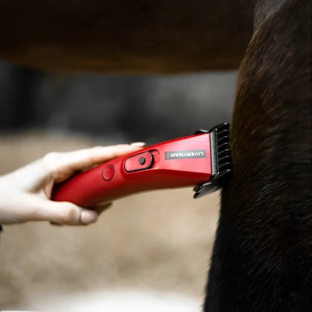 Red electric liveryman nova trimmer with black comb attachment for easy horse grooming and clipping