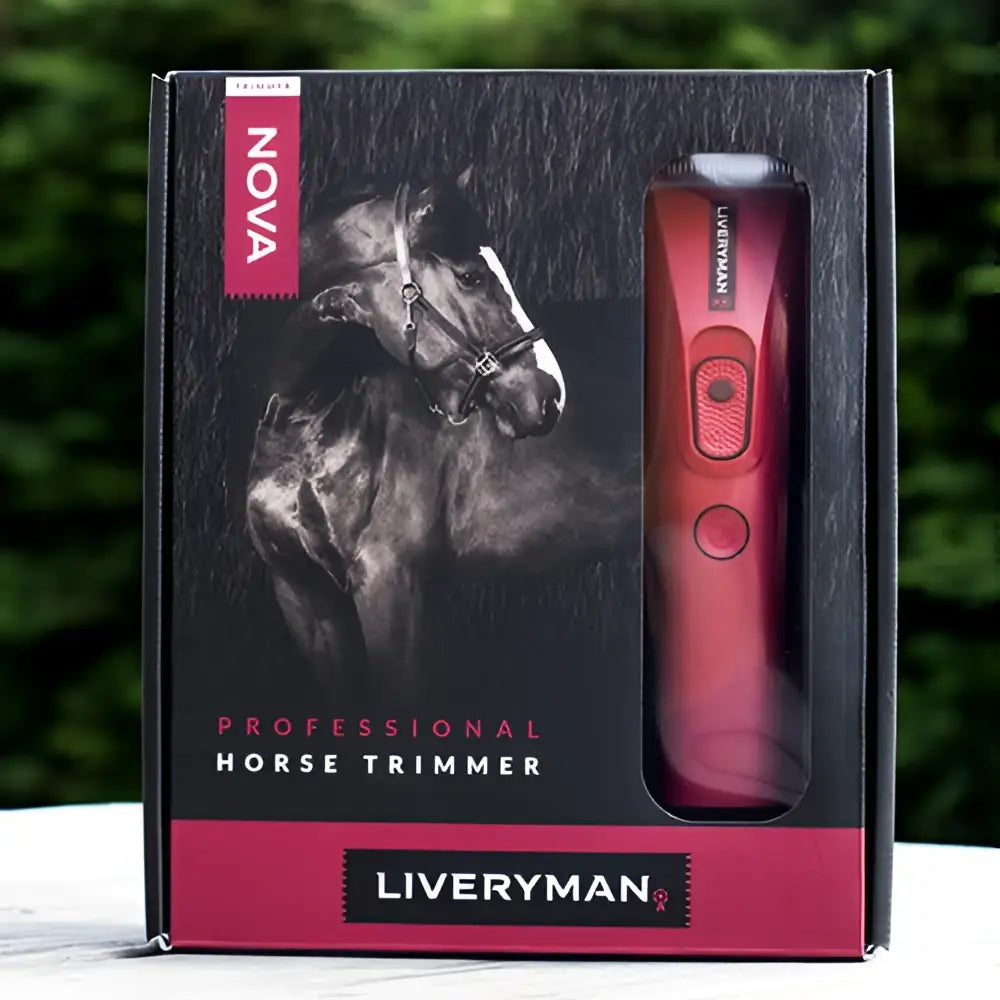 Red plastic liveryman nova trimmer with textured grip and two circular buttons for easy horse grooming use