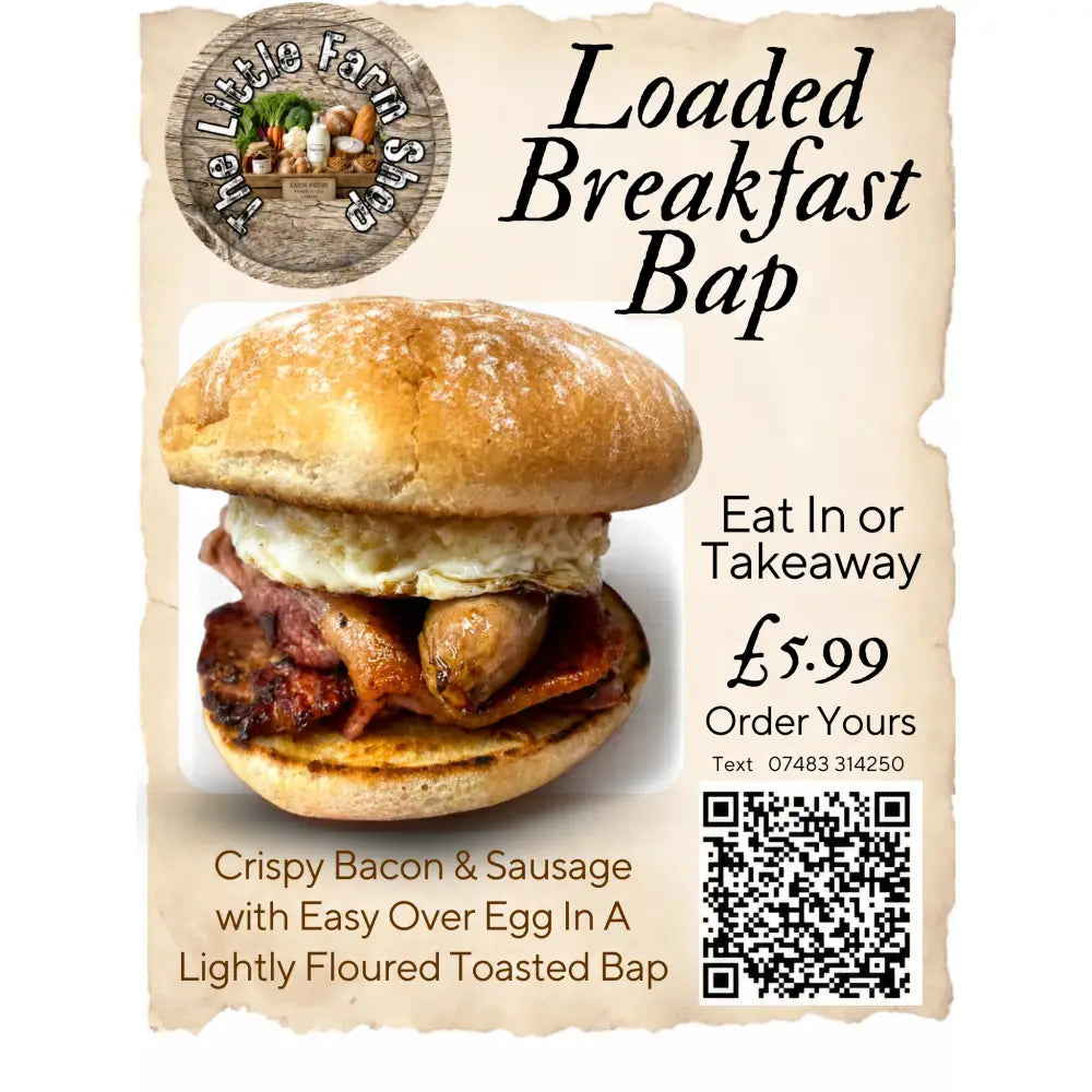 A loaded breakfast bap with golden toasted bap filled with crispy bacon, sausage, and a fatty acids rich egg topping