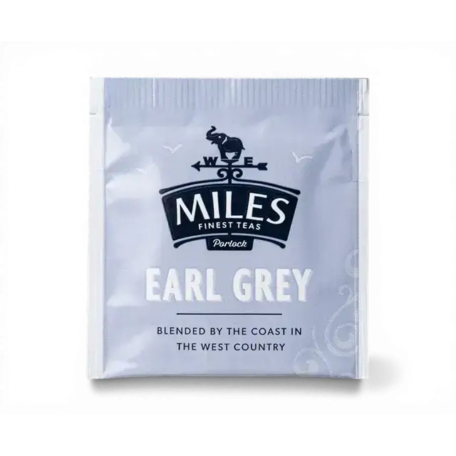 A silver foil earl grey envelope teabag packet from miles tea featuring an elephant and compass design in white text