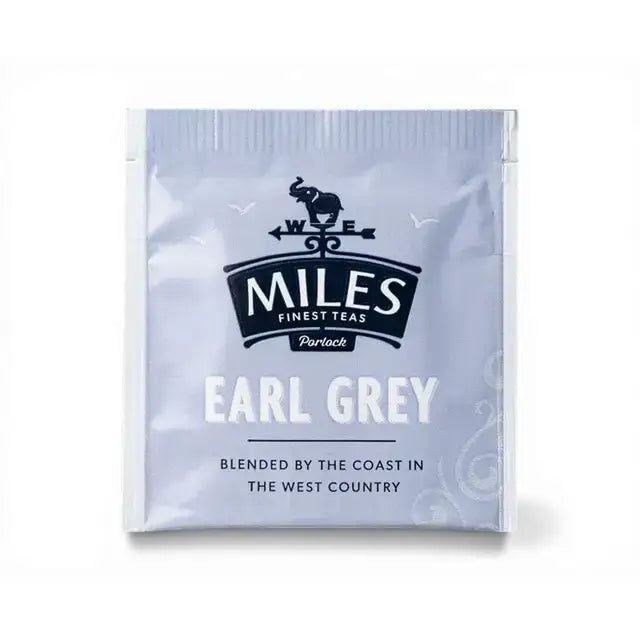 A silver foil earl grey envelope tea bag from miles tea featuring italian bergamot oil with elephant and compass logo