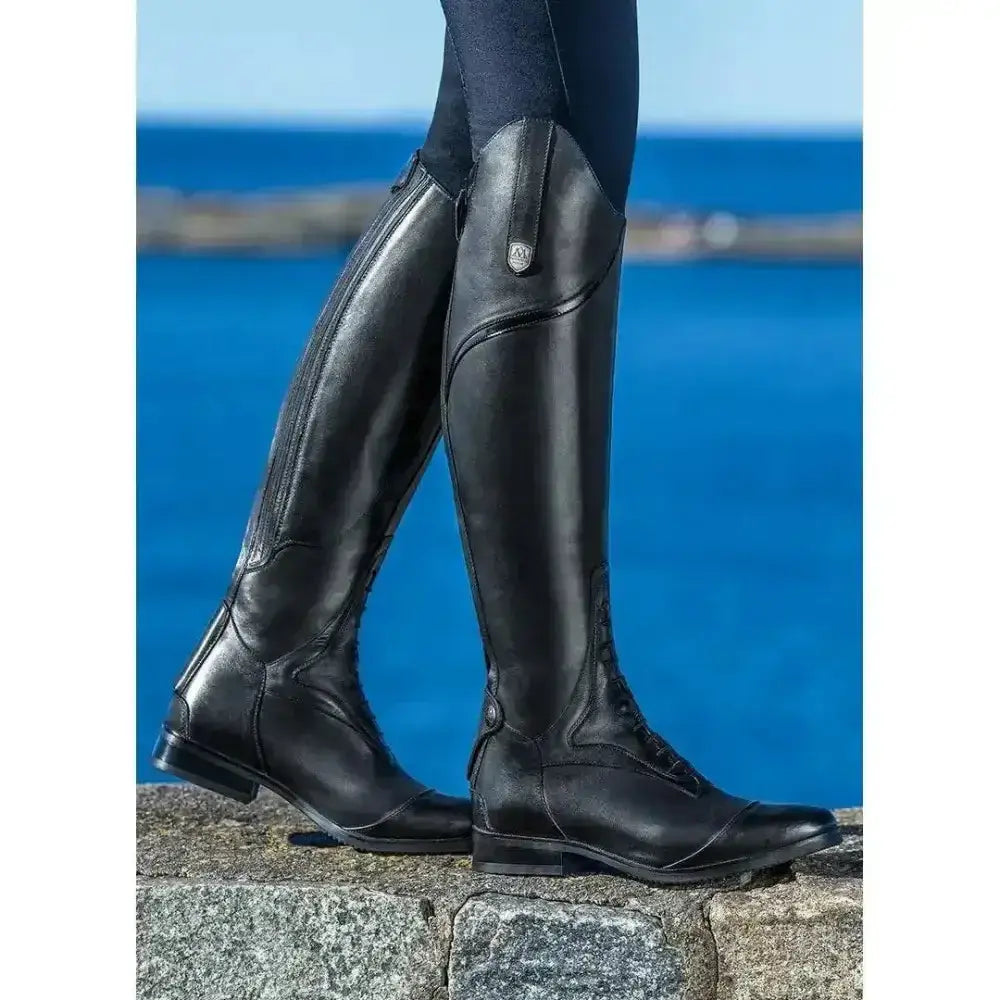 Black leather mountain horse sovereign young rider riding boots with sleek glossy finish and subtle stitching details