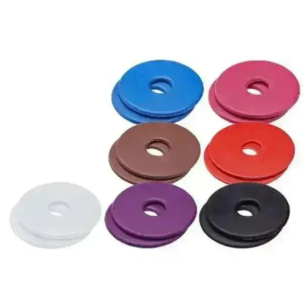 Set of colorful rubber bit guards in blue pink brown red purple black and white to protect horses lips