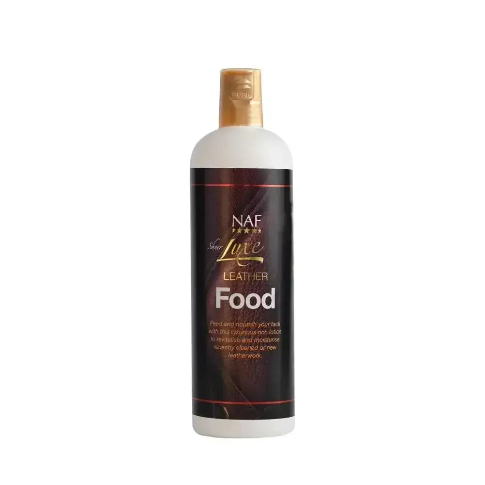 A white bottle with a gold cap and dark label for naf sheer luxe sheer luxe leather nourishing rich lotion