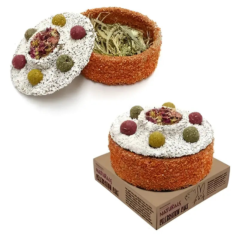 Orange and white textured hay feeder with colorful decorative balls on top for naturals celebration cake x6