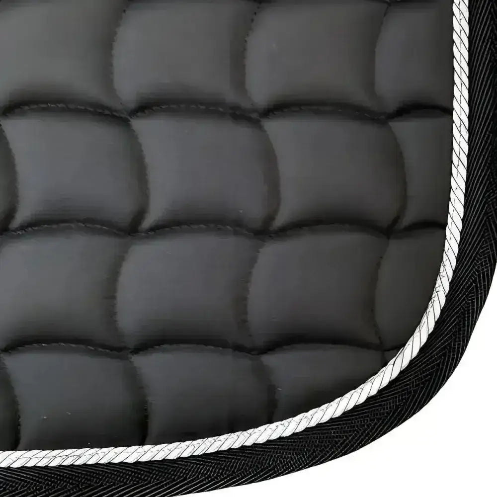 New galop black quilted dressage saddle pad with white rope trim featuring contoured spine and anti-rub girth pad
