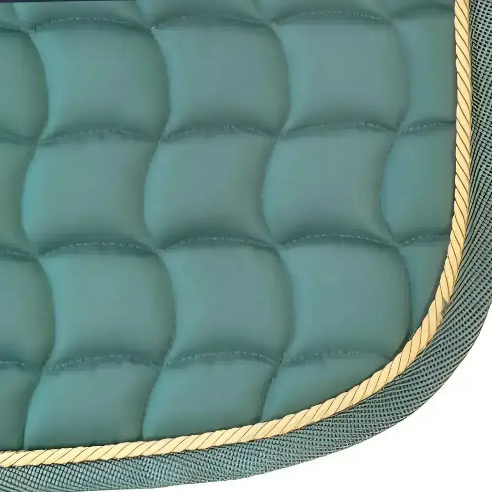 New gallop dressage saddle pad in teal with gold rope trim features a contoured spine and anti-rub girth pad