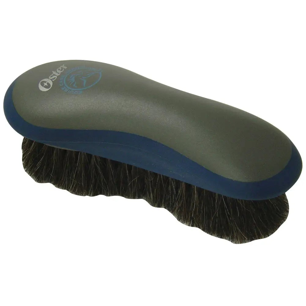 Oster hair finishing brush with dark green and blue ergonomic handle and dense black horse hair bristles for grooming