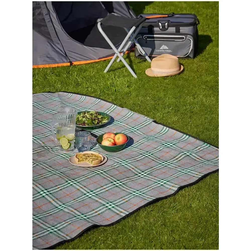 Gray and green plaid ozark trail picnic rug with black border perfect for outdoor trail picnic use