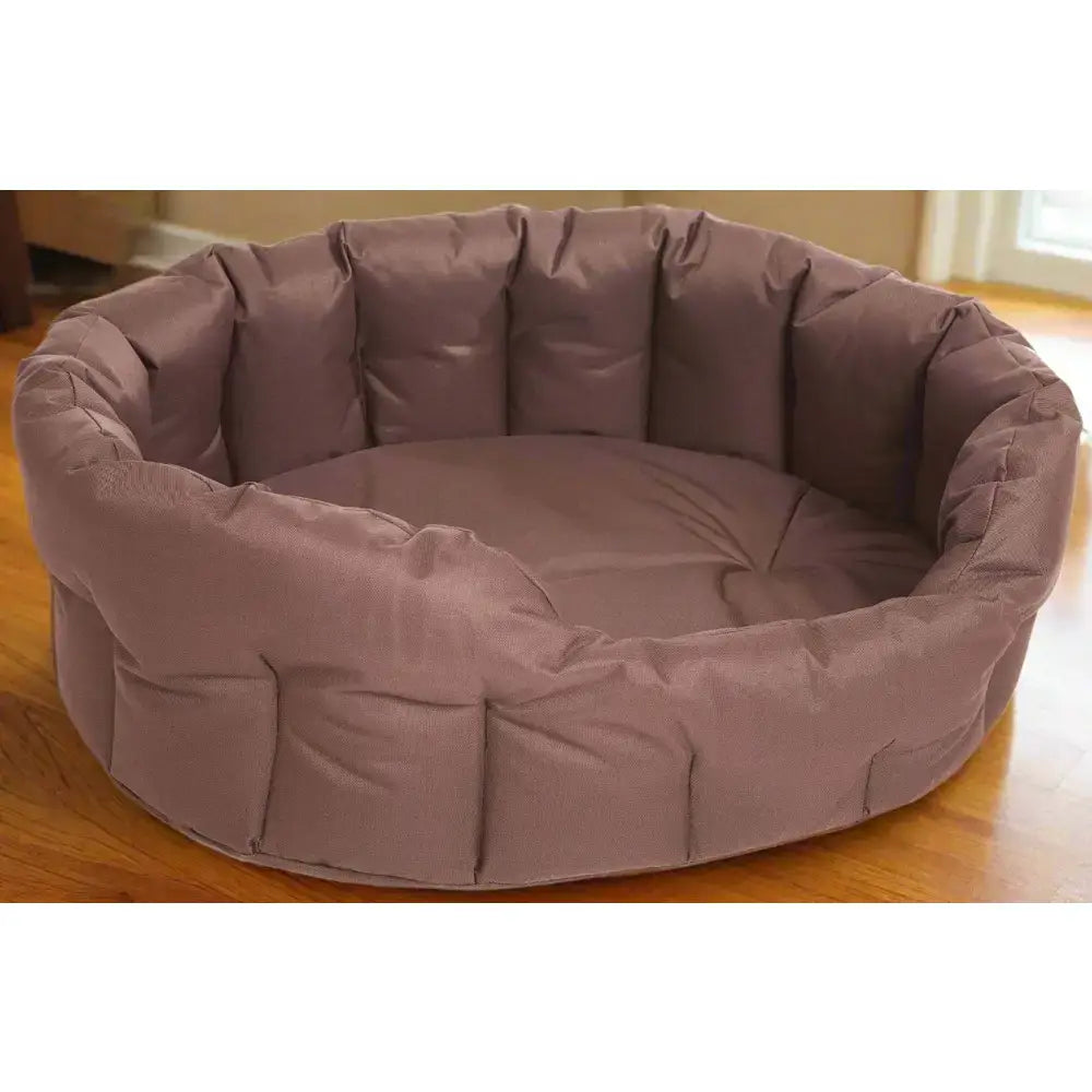 A plush mauve country dog tough heavy duty oval waterproof dog bed with quilted padded soft fabric design