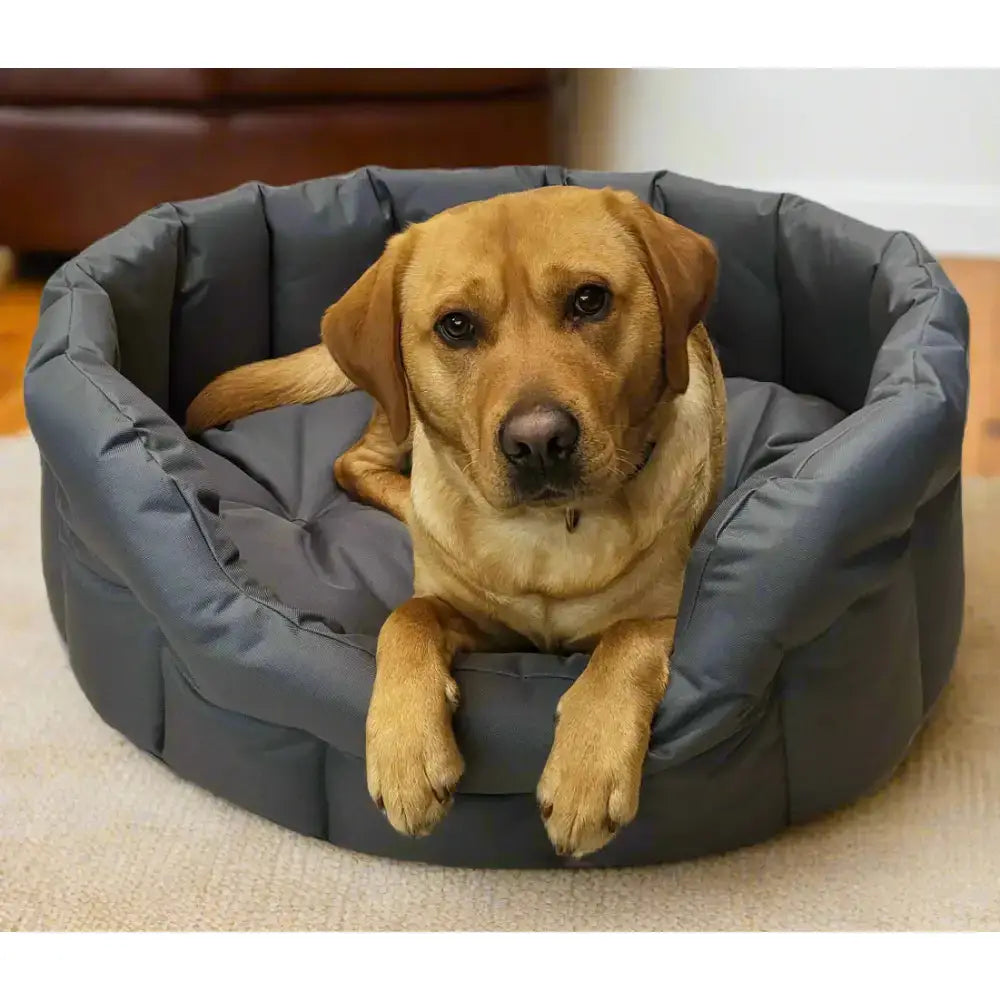 Cozy dark gray quilted heavy duty oval dog bed with plush cushioned interior by p&l country dog tough waterproof design