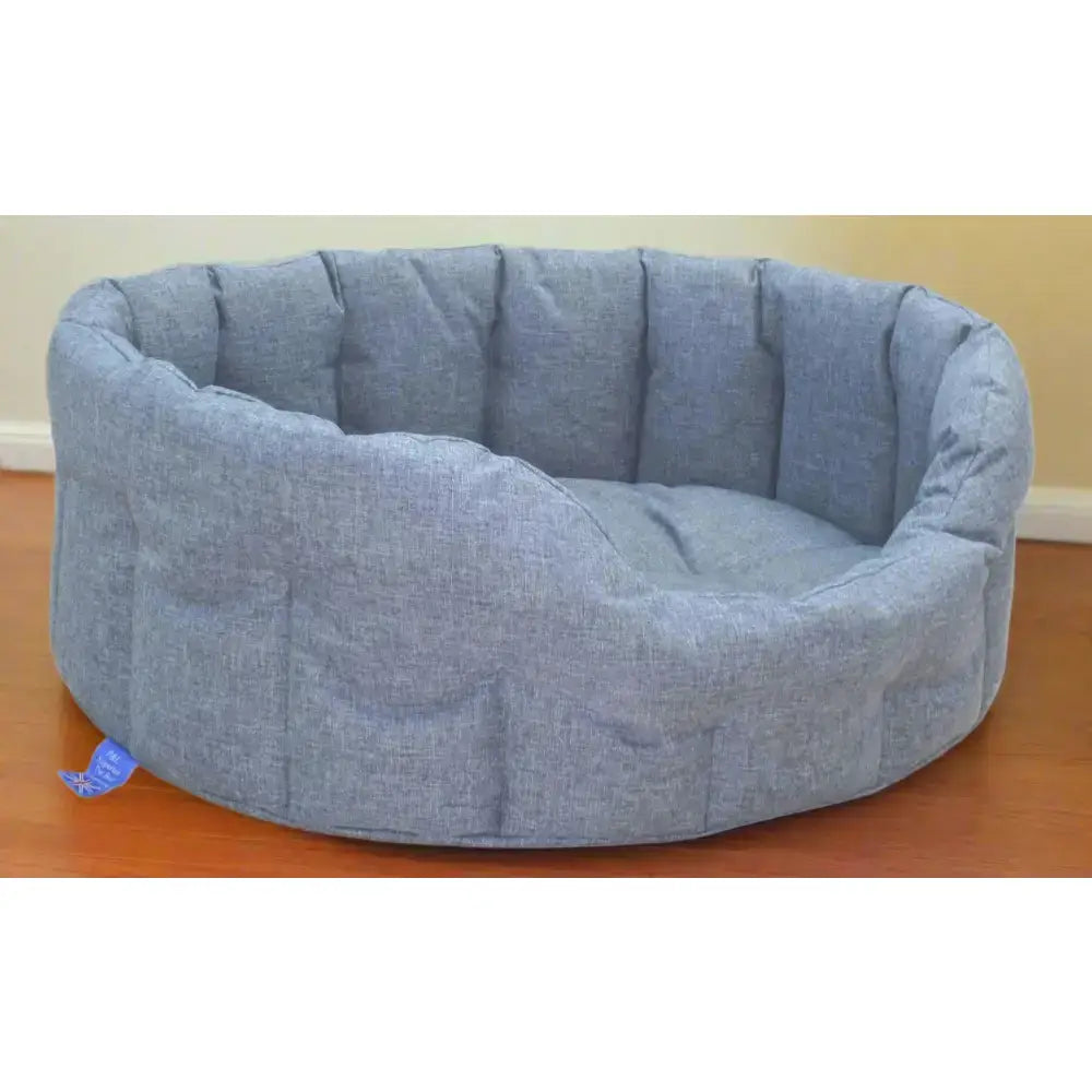 Blue textured fabric country dog tough heavy duty oval waterproof dog bed with padded rounded edges and cozy interior