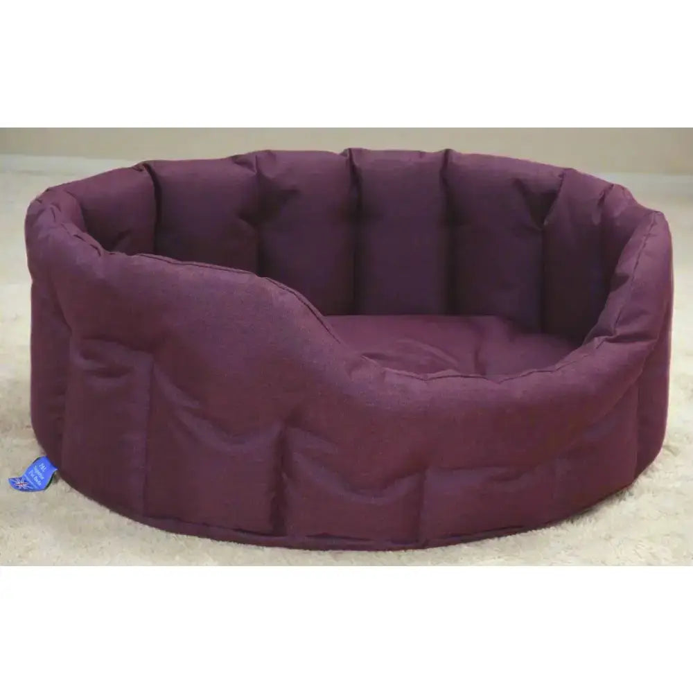 Purple quilted heavy duty oval dog bed with soft cushioned interior and padded edges from country dog tough waterproof line