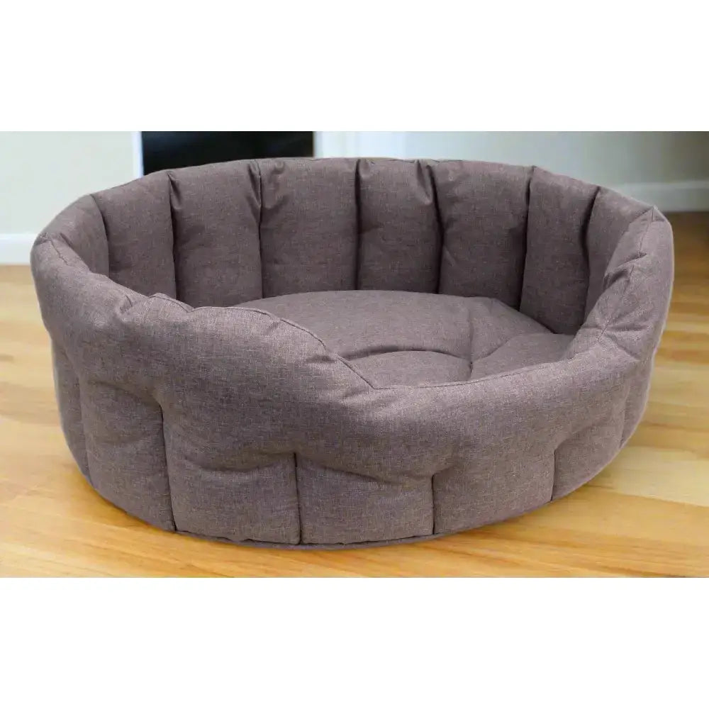 A cozy gray heavy duty oval country dog tough pet bed with quilted waterproof fabric and plush cushioning