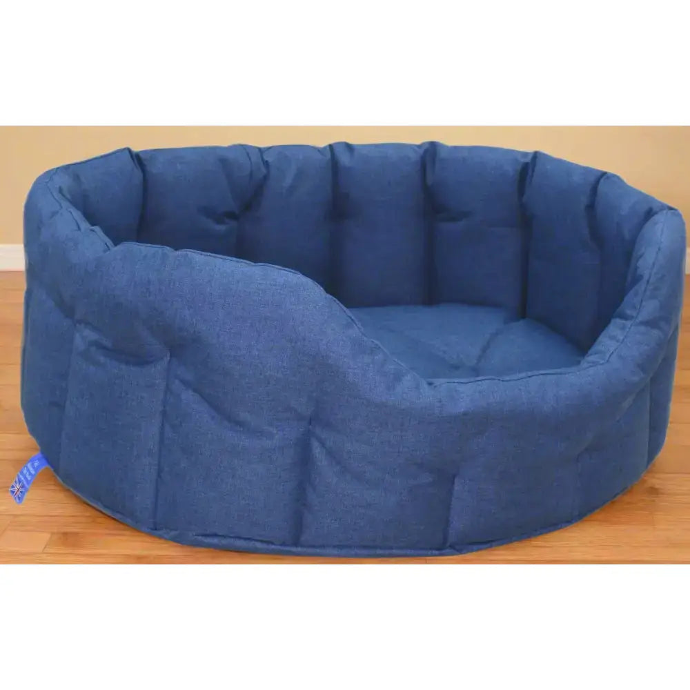 Blue denim style country dog tough heavy duty oval waterproof dog bed with soft cushioning and rounded cozy design