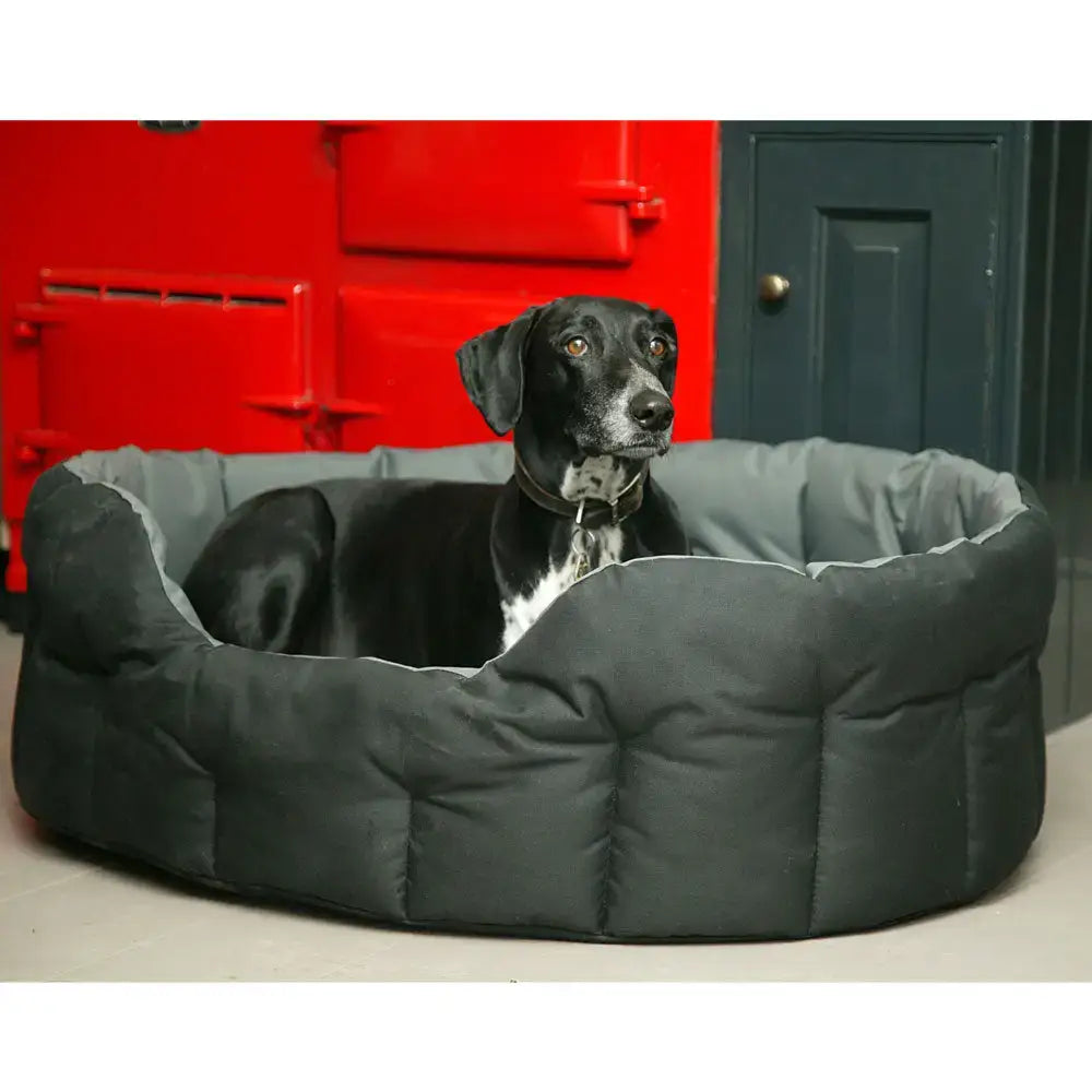 Black and gray quilted heavy duty oval dog bed with plush cushioned interior from country dog tough waterproof dog line