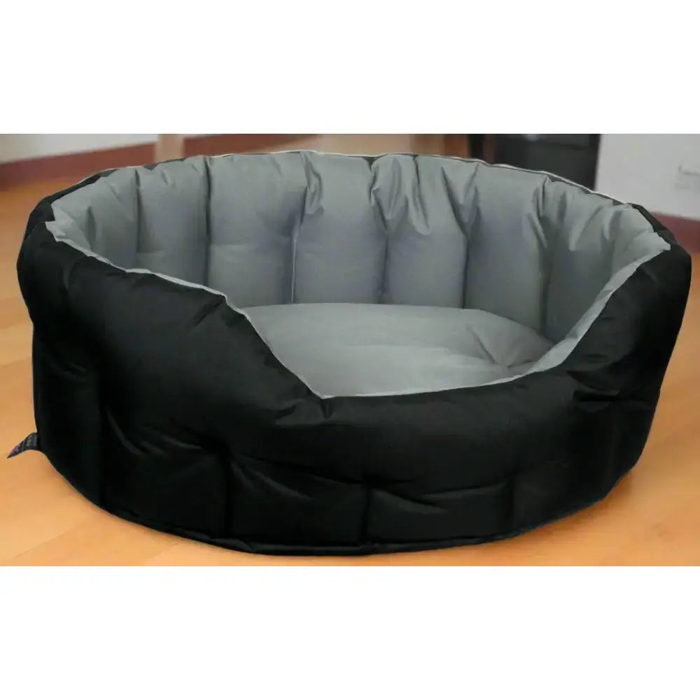 Black and gray plush country dog tough heavy duty oval waterproof dog bed with cushioned rounded design