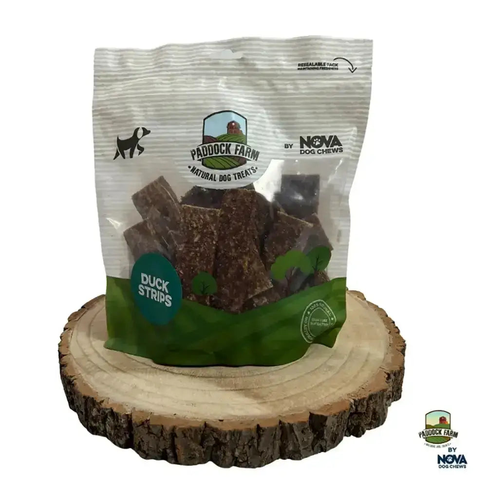 Pack of paddock farm strips dog treats in a clear and green resealable plastic bag for easy storage