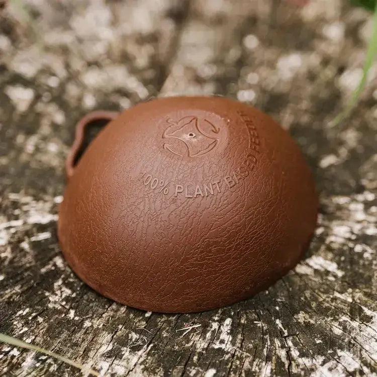 Brown textured plant-based leather keychain with embossed patent pending peckish logo and 100 percent plant based fermented text