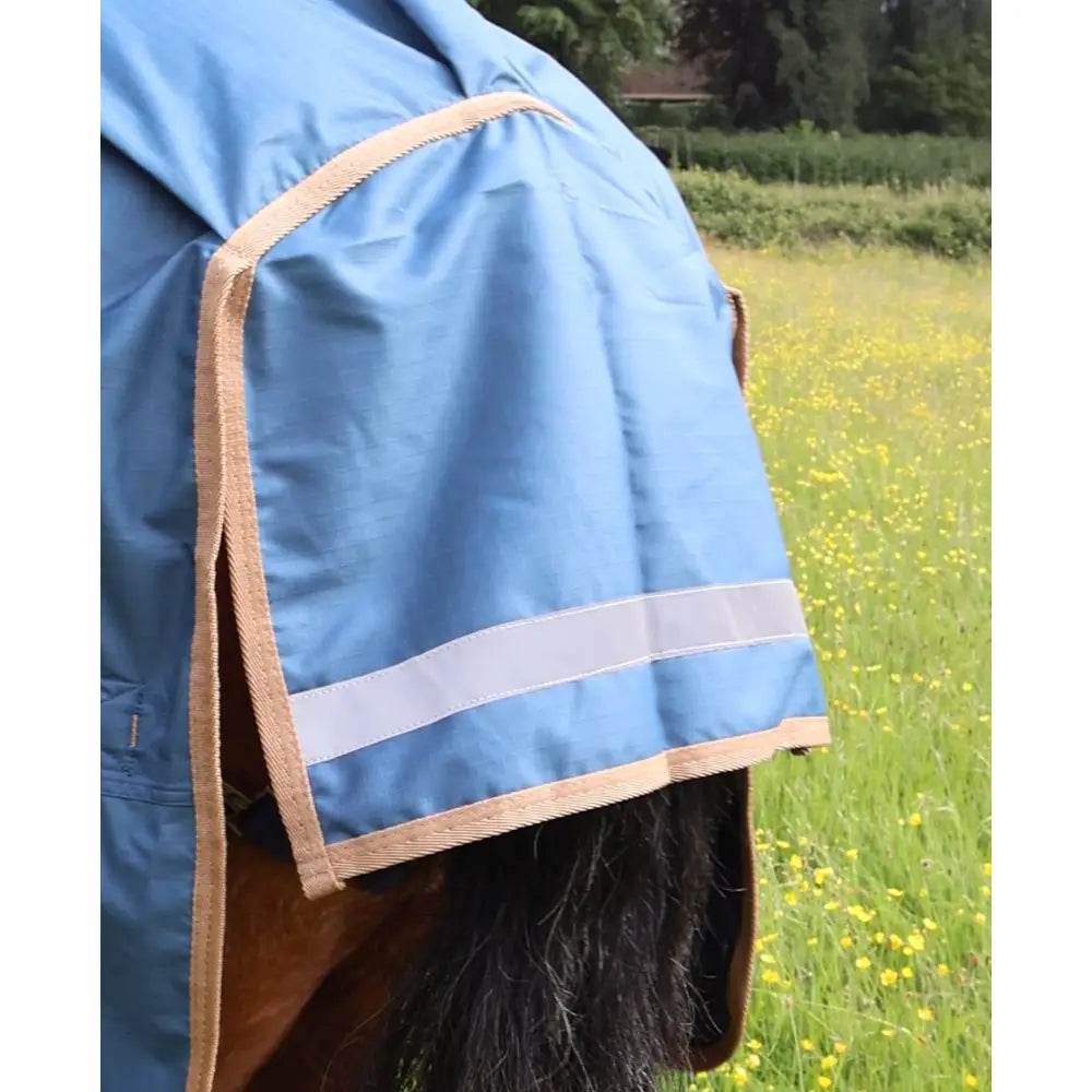 Blue perf combo 0g lightweight turnout rug for horses with tan trim and reflective stripe for safety and comfort