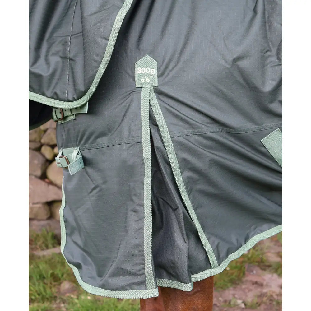 Dark gray turnout rug with light green trim and reinforced stitching featuring perf detachable neck 300g heavy weight tag