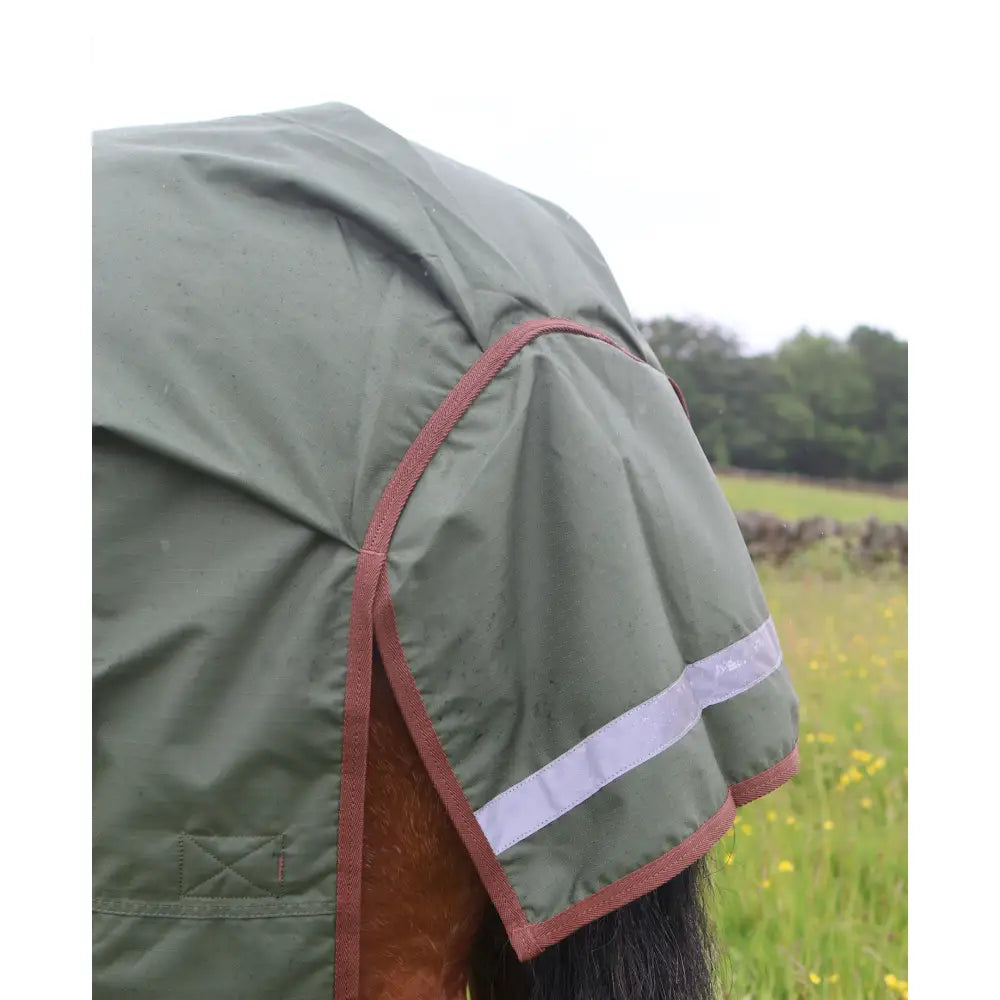 Olive green perf standard 100g lightweight turnout rug for horses with red trim and reflective strip waterproof design
