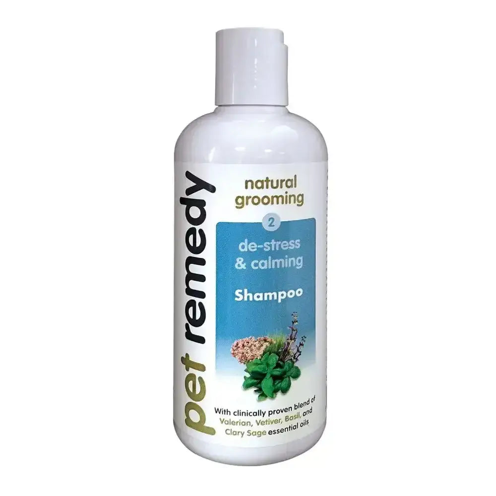 White plastic bottle of pet remedy shampoo with blue herb label and white cap for naturally derived cleansing and calming