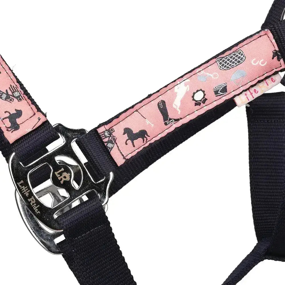 Pink patterned horse-themed harness strap with black webbing and silver buckle from little rider pony passion head collar lead rope set