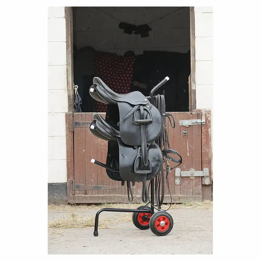 Black leather portable saddle mounted on wheeled rack with red wheels saddle racks that holds three saddles