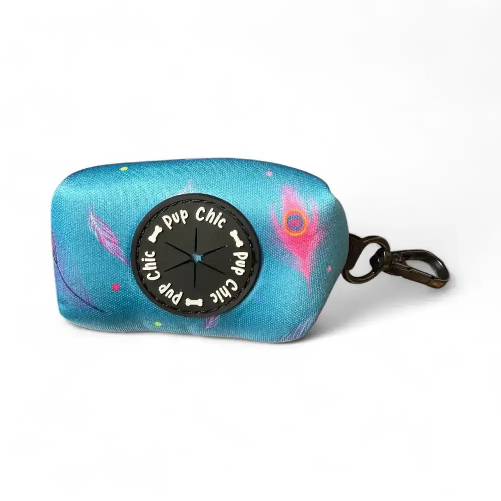 A turquoise power peacock poo fabric bag holder with pup chic button and pink feathers for easy clean-ups