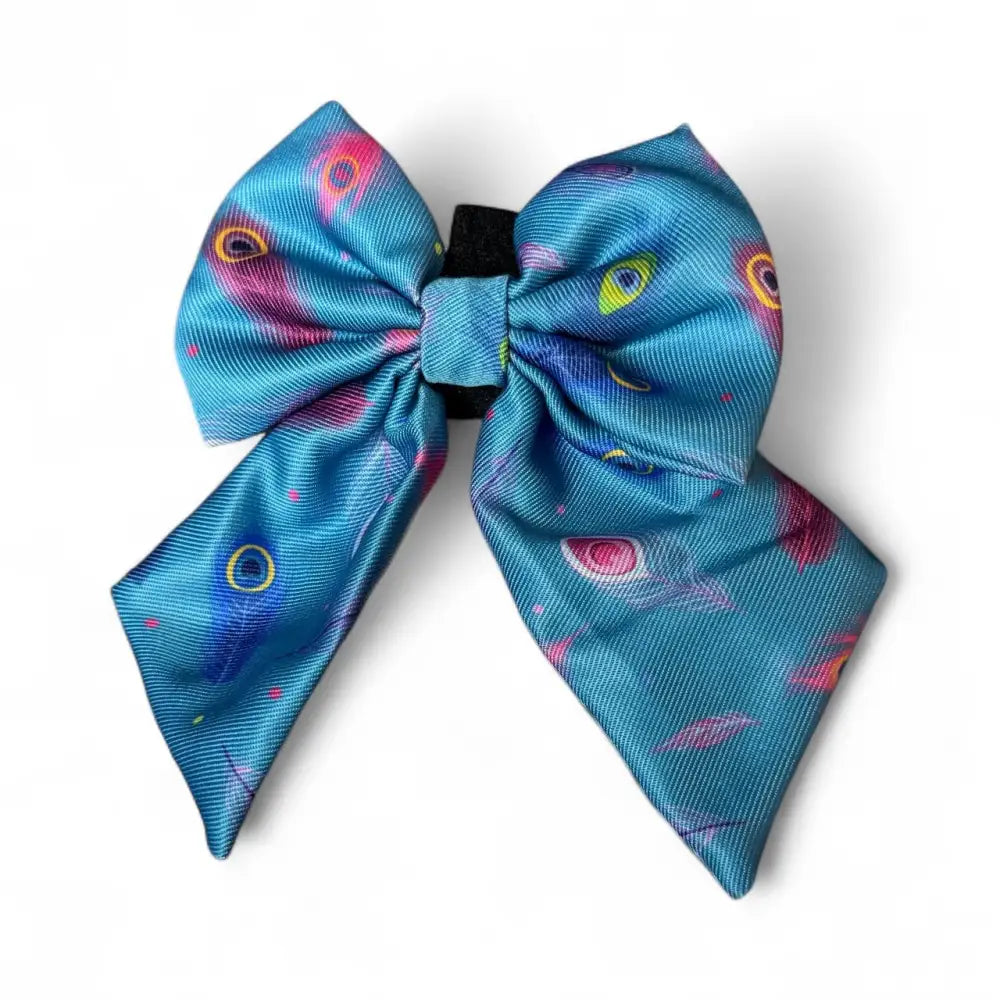 Vibrant turquoise satin peacock sailor bow with playful pink yellow purple eye pattern from power peacock collection