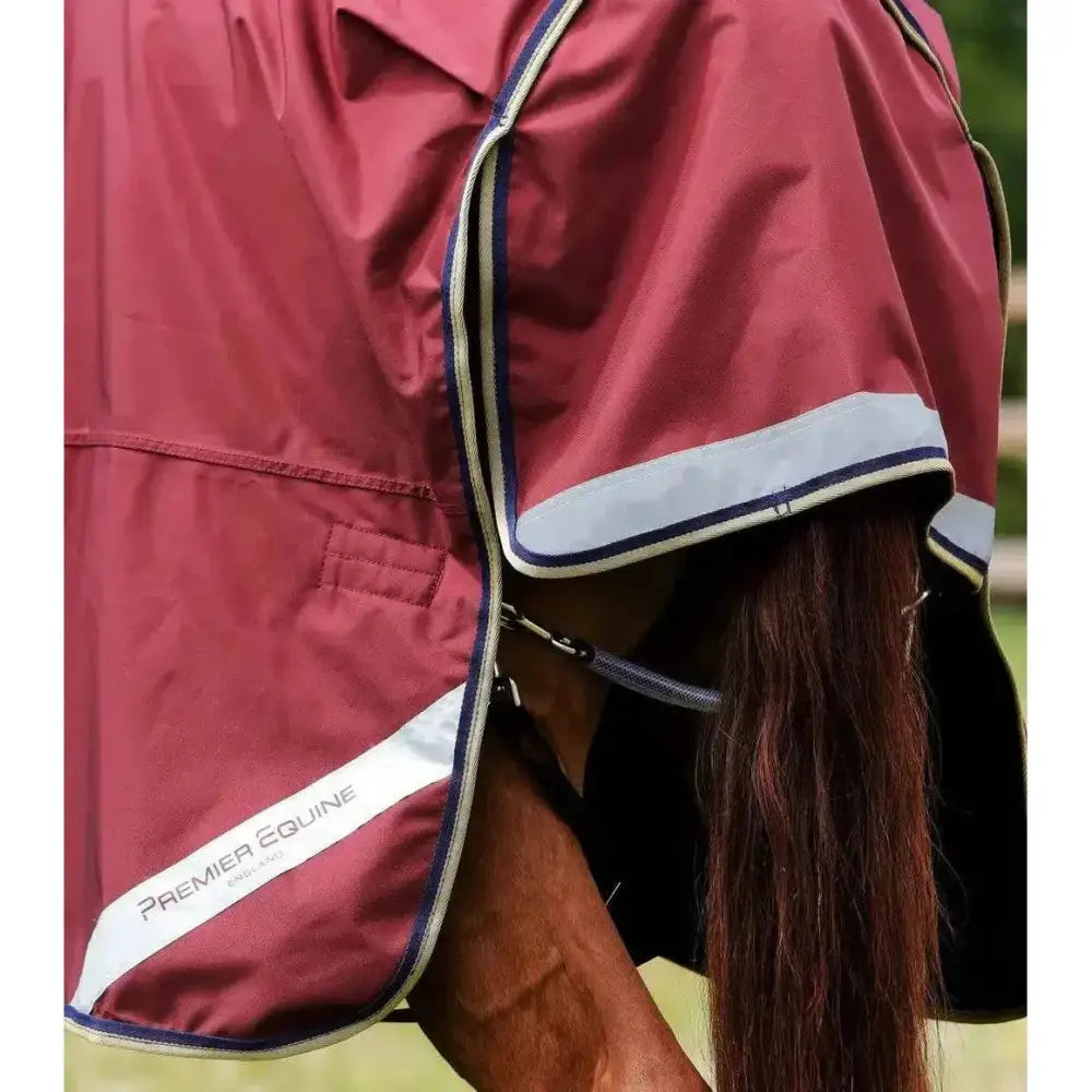 Maroon premier equine buster turnout rug with reflective white and navy trim made of denier ballistic nylon
