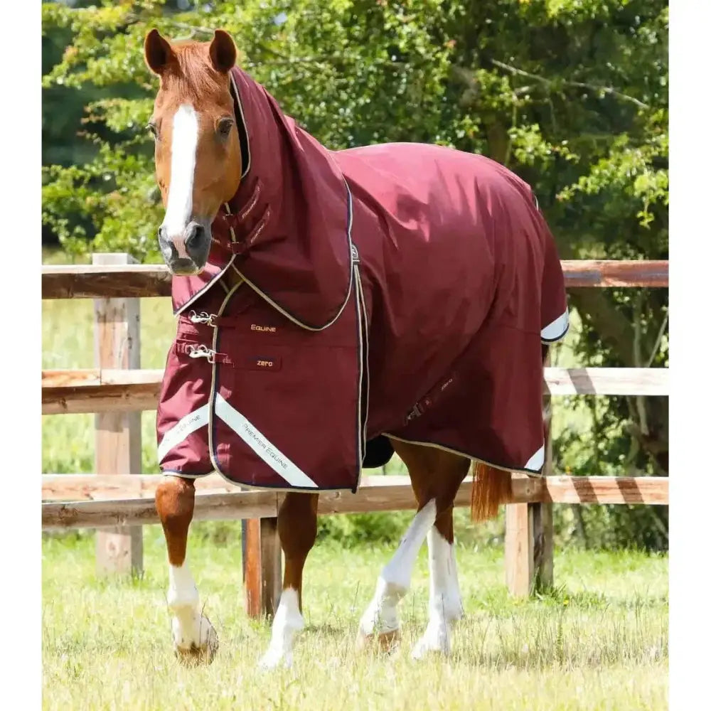 Maroon premier equine buster turnout rug with white reflective stripes and silver hardware made from denier ballistic nylon