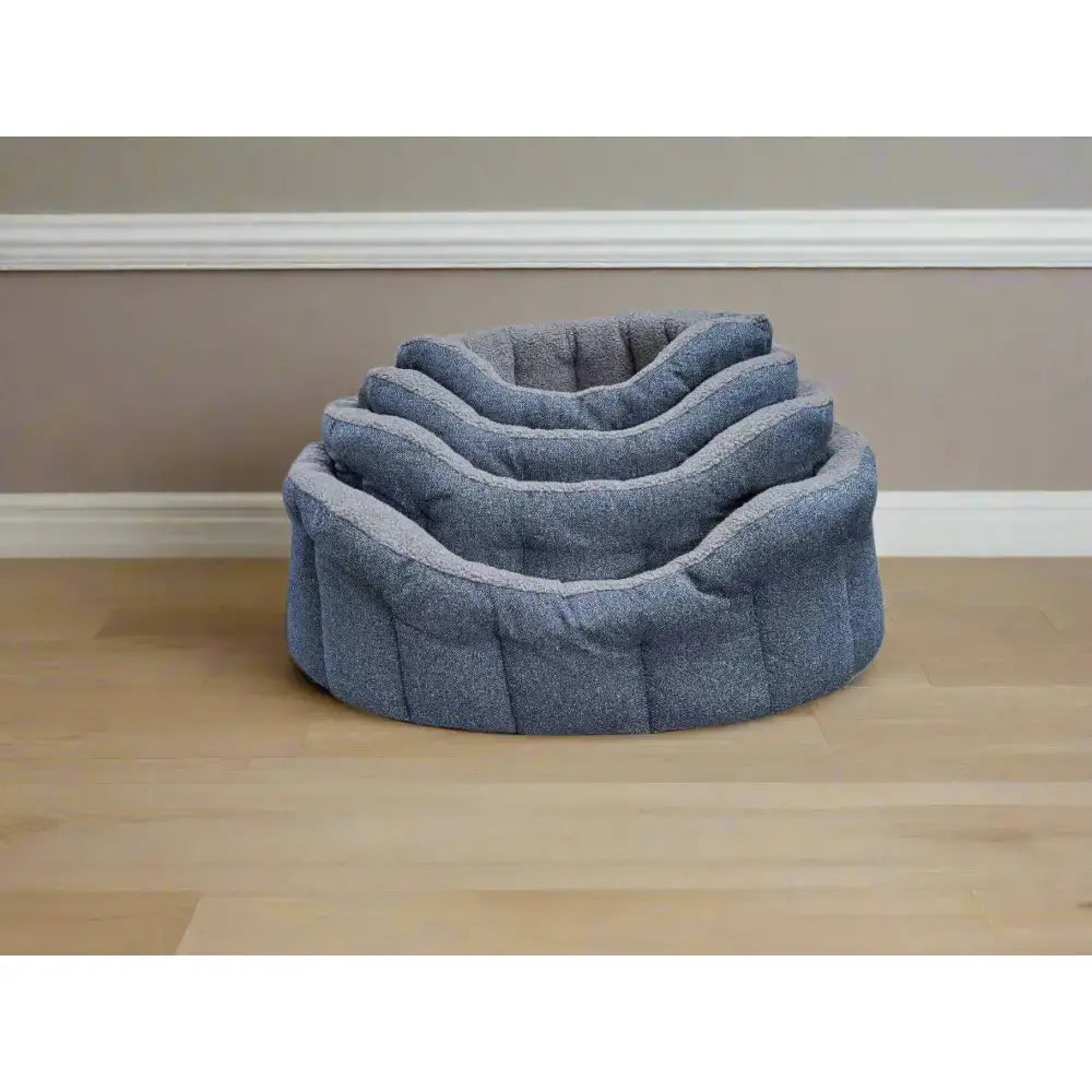 Stacked set of three gray orkney tweed fleece lined bolster beds with sherpa fleece lining and cozy quilted fabric