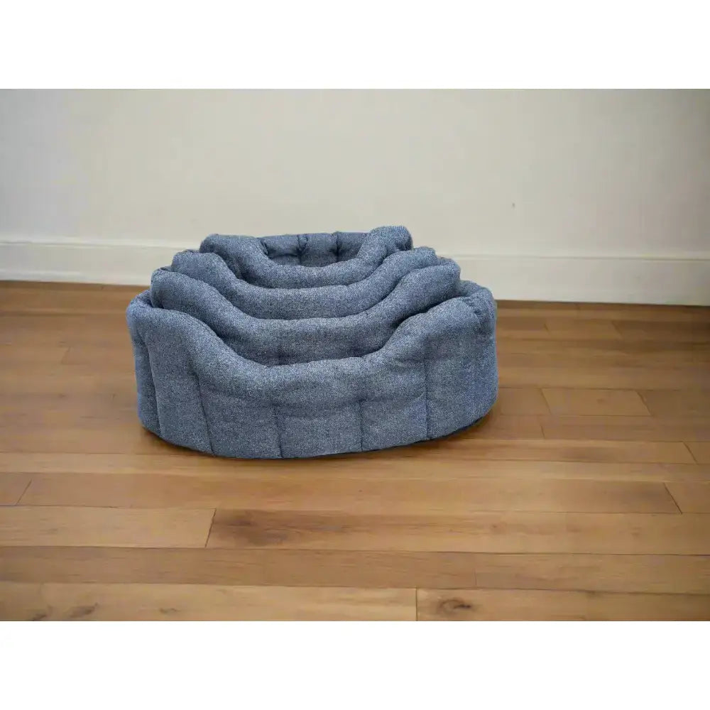 Blue textured fabric premium orkney tweed oval beds with tiered cushioned layers and a 7cm base for pets