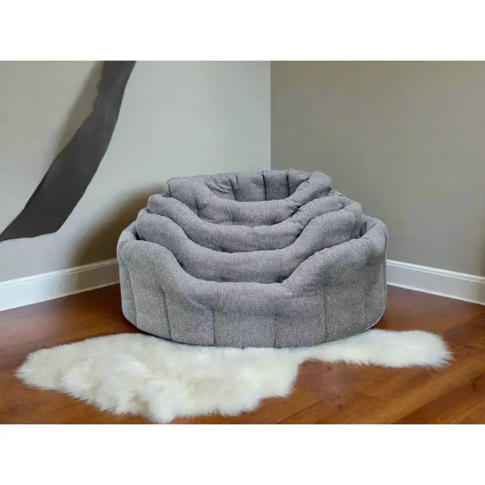 Gray plush premium orkney tweed oval bed with soft textured fabric and 7cm base for cozy pet comfort