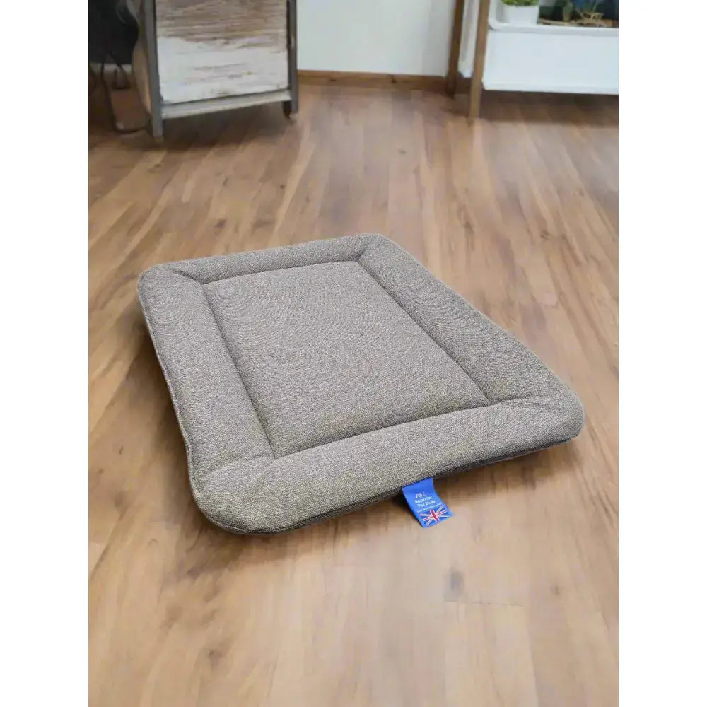Gray textured premium orkney tweed rectangular dog bed with padded design and blue union jack tag by P&L country dog beds