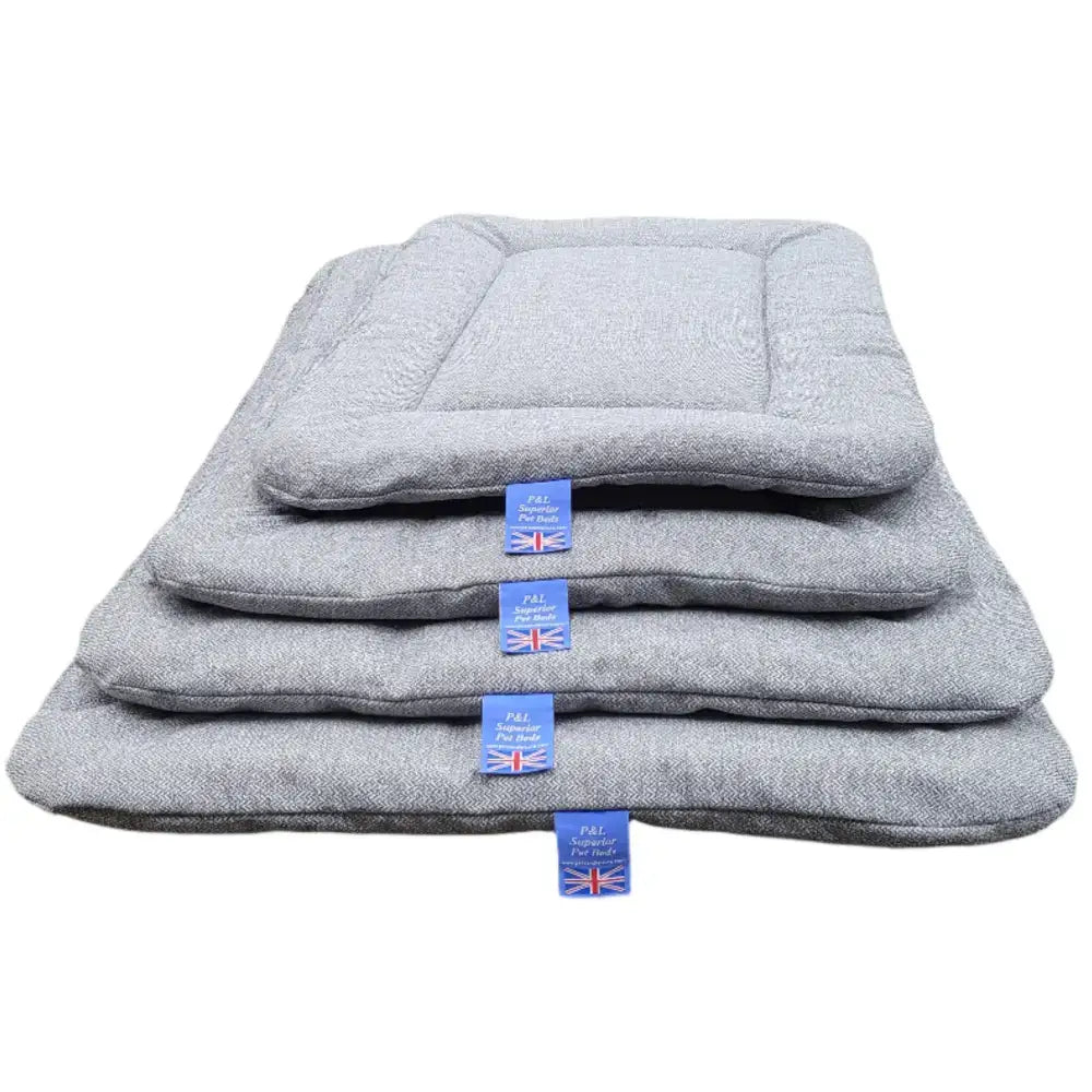 Stacked premium orkney tweed rectangular gray herringbone pet beds with blue branded tags by p&l country dog beds