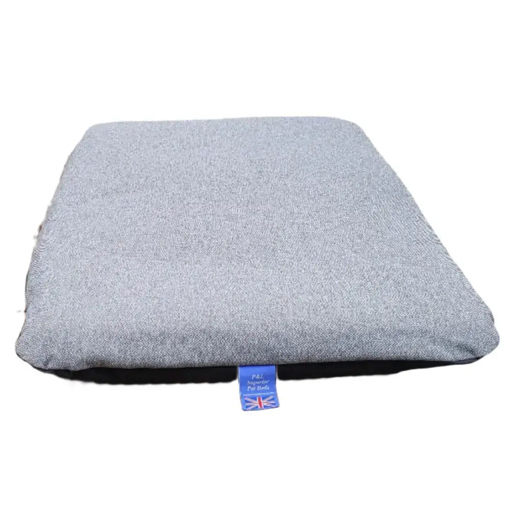 Gray textured cushion with blue union jack tag shown with premium orkney tweed removable cover duvet