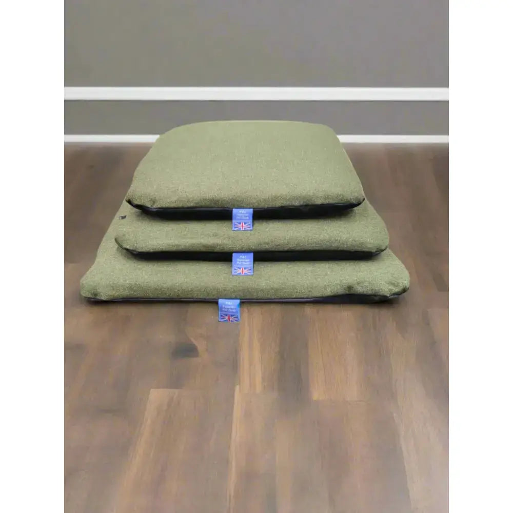Olive green felt pet bed with black trim and union jack tag featuring a premium orkney tweed removable cover duvet