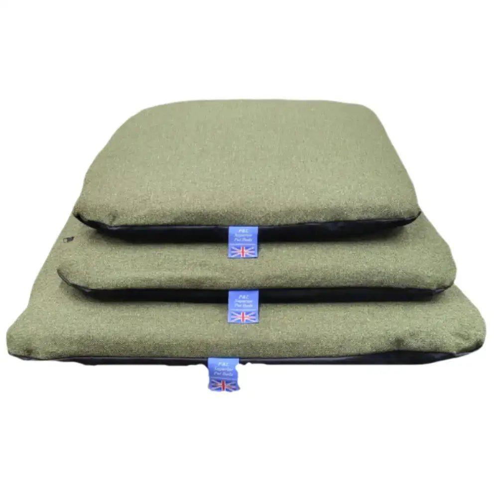Three olive green premium orkney tweed pet cushions stacked with removable cover duvet and union jack tag