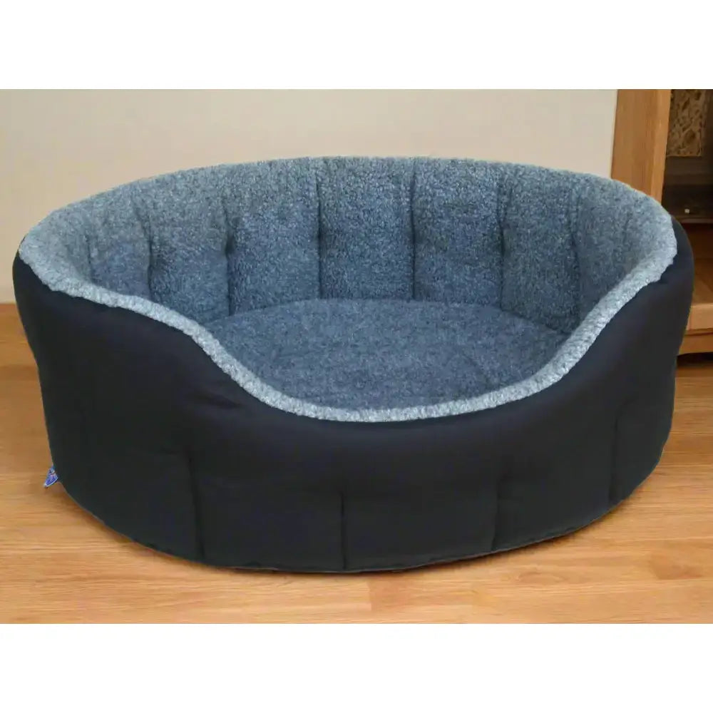 Premium oval bolster style dog bed with heavy duty fleece lining in dark navy and soft blue machine washable design