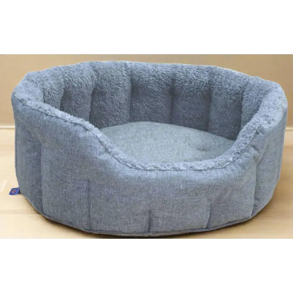 Soft blue premium oval bolster heavy duty fleece lined dog bed with quilted exterior and machine washable cover